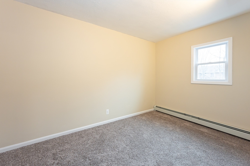 29 Mill Street, Unit B Dracut, MA 01826 - Photo 19 of 37 an empty room with a window