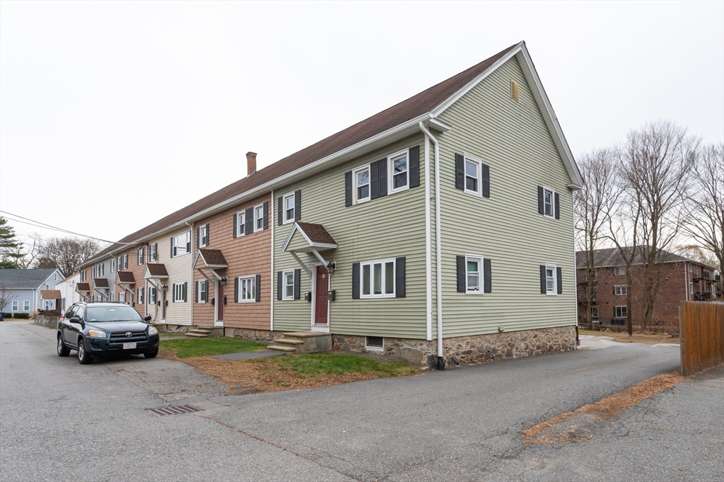 29 Mill Street, Unit B Dracut, MA 01826 - Photo 2 of 37 a view of a car park in front of house