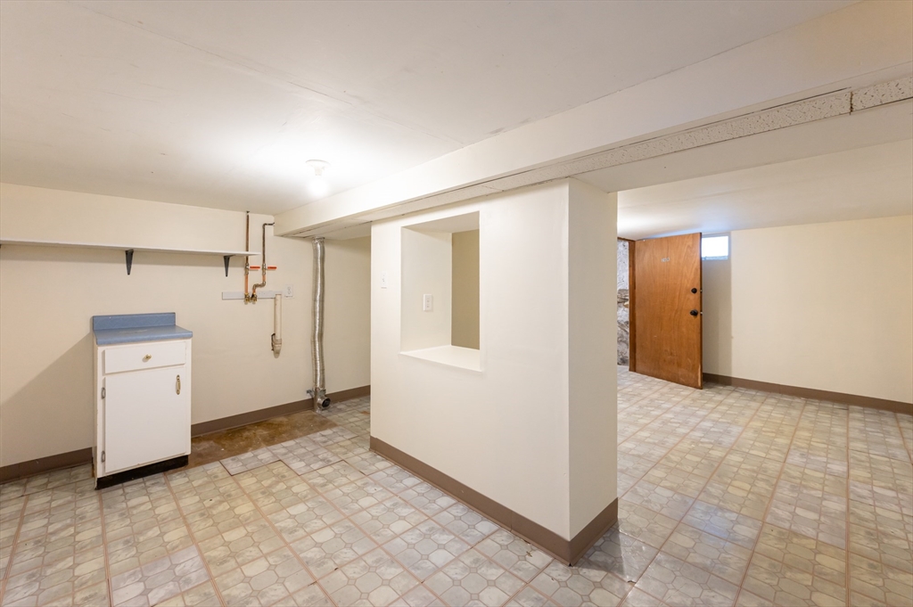 29 Mill Street, Unit B Dracut, MA 01826 - Photo 25 of 37 a view of a storage & utility room with refrigerator
