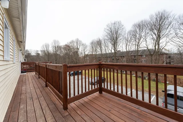 a view of balcony with wooden floor