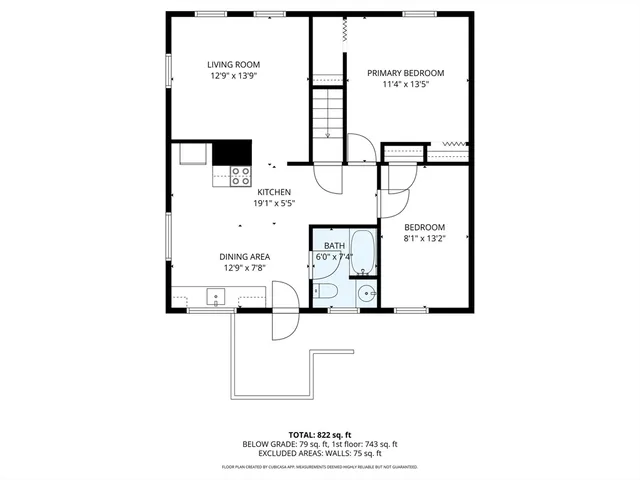 a picture of a bench in front of a wall