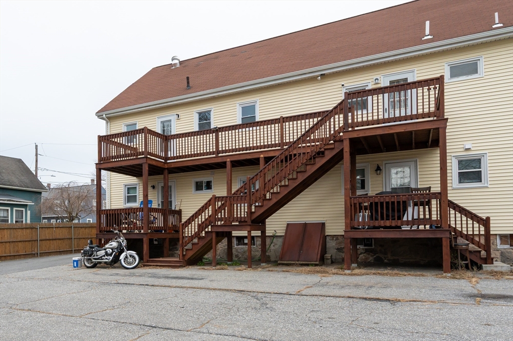 29 Mill Street, Unit B Dracut, MA 01826 - Photo 32 of 37 a view of a car park in front of house