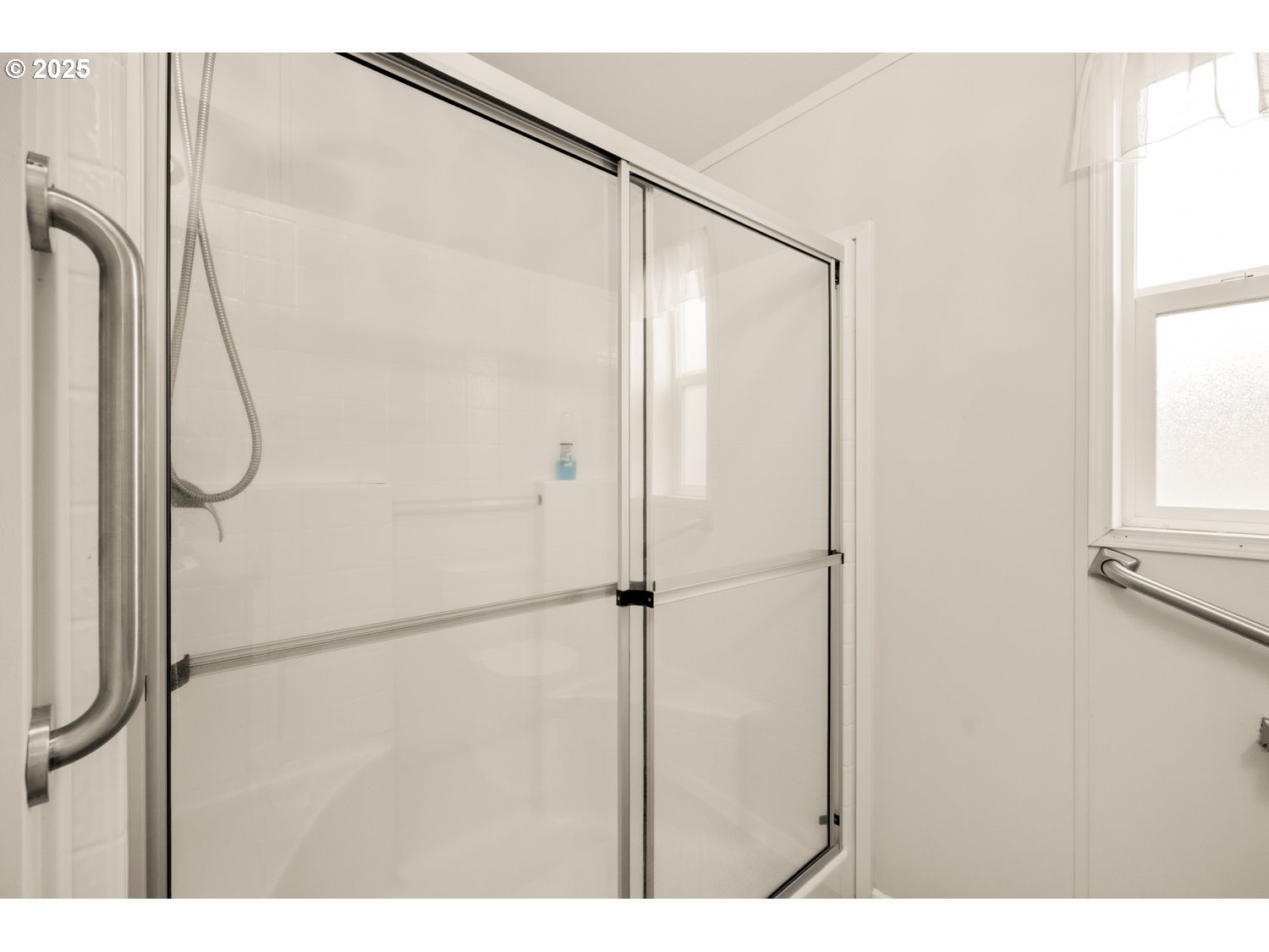 2696 Southeast Palmquist Road Gresham, OR 97080 - Photo 12 of 21 a bathroom with a shower and a glass door