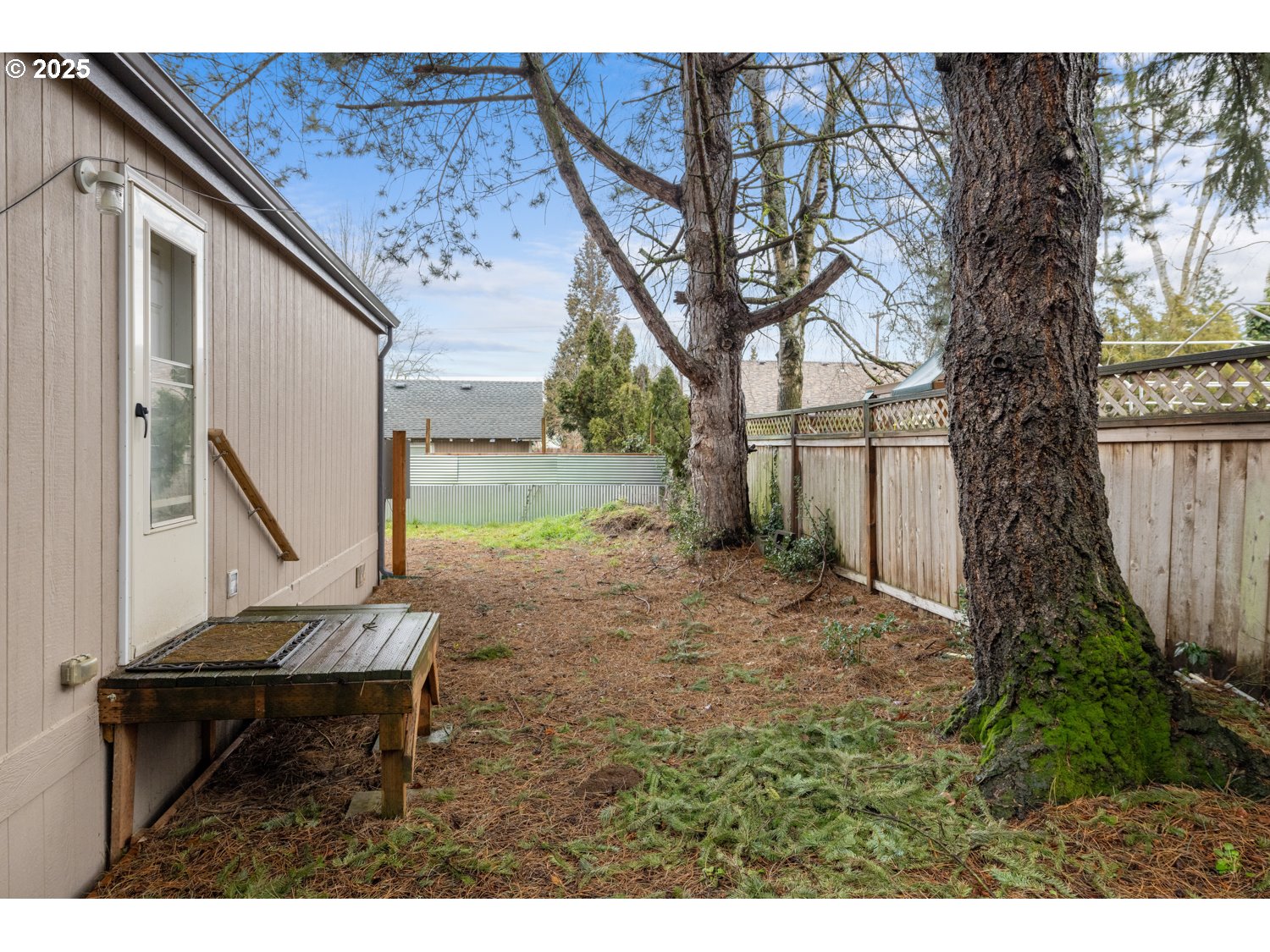 2696 Southeast Palmquist Road Gresham, OR 97080 - Photo 18 of 21 a backyard of a house with table and chairs