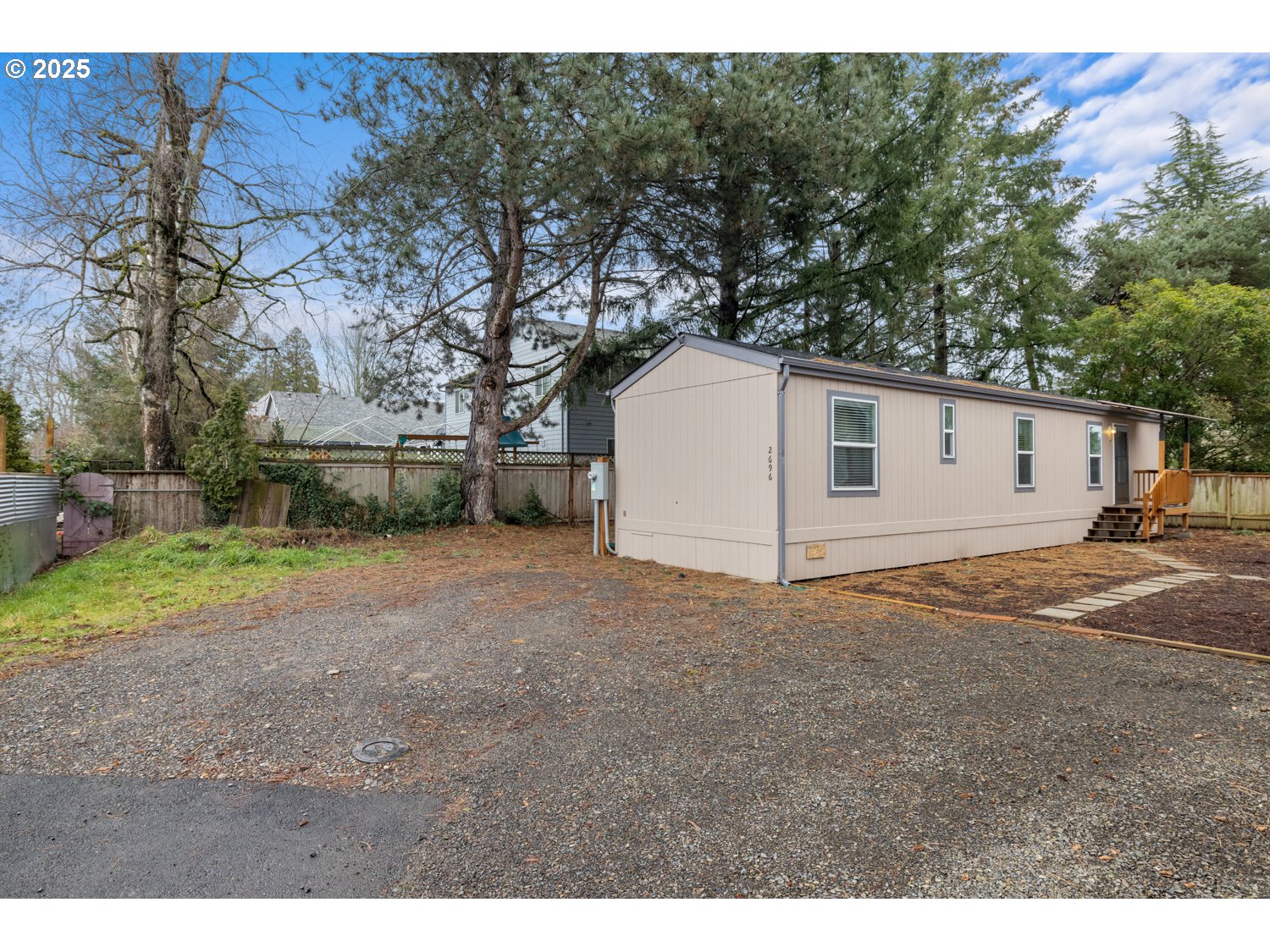 2696 Southeast Palmquist Road Gresham, OR 97080 - Photo 2 of 21 a view of a backyard of the house
