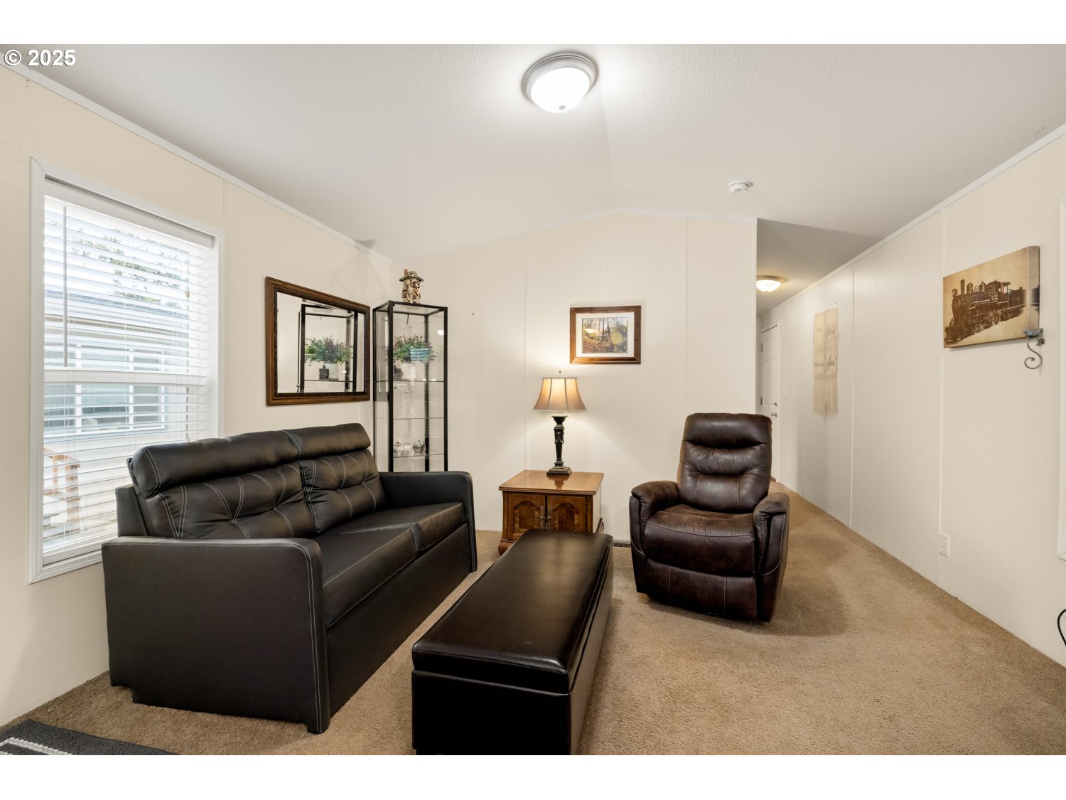 2696 Southeast Palmquist Road Gresham, OR 97080 - Photo 9 of 21 a living room with furniture and a flat screen tv