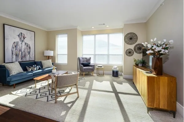 a living room with furniture and a large window