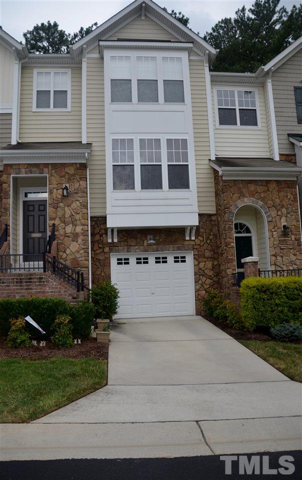 5045 Celtic Court Raleigh, NC 27612 - Photo 1 of 25 a front view of a house with a garden