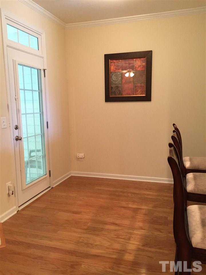 5045 Celtic Court Raleigh, NC 27612 - Photo 4 of 25 a view of an empty room with window and wooden floor