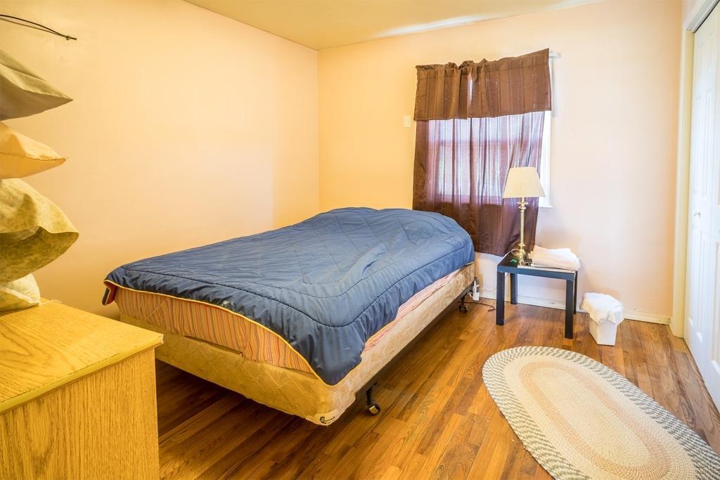 1910 White School House Road Cave Junction, OR 97523 - Photo 12 of 25 a bed sitting in a bedroom next to a window
