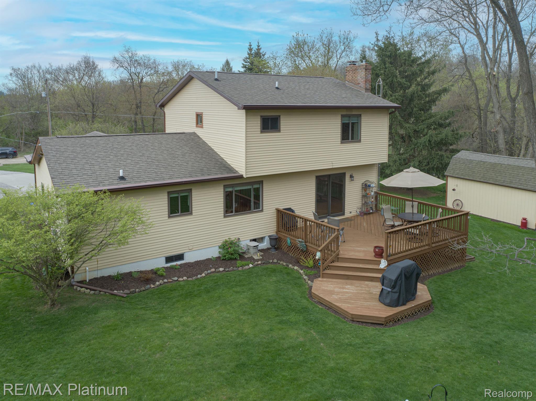 11585 Tipsico Lake Road Fenton, MI 48430 - Photo 23 of 32 Back Exterior with huge deck for entertaining