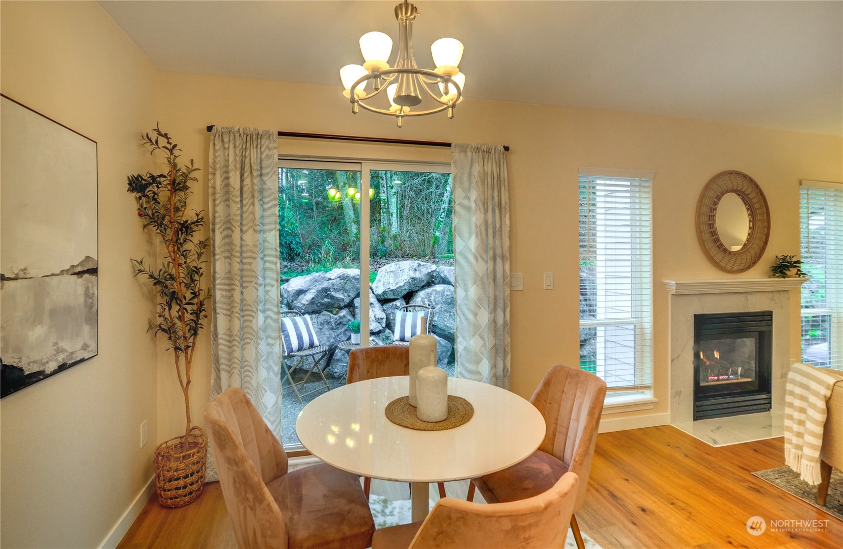 23111 15th Avenue Southeast, Unit E3 Bothell, WA 98021 - Photo 11 of 30 a view of a dining room with furniture window and wooden floor