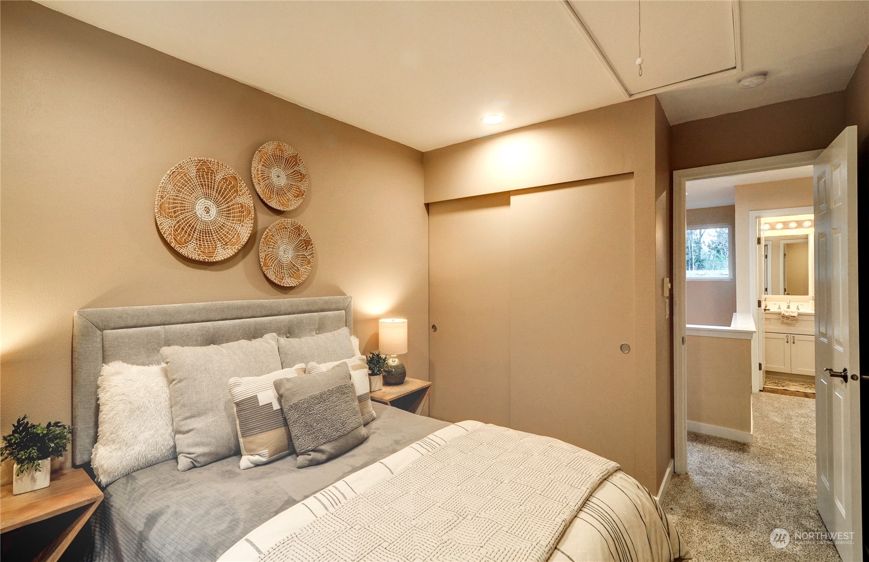 23111 15th Avenue Southeast, Unit E3 Bothell, WA 98021 - Photo 18 of 30 a bedroom with a bed and a table in it