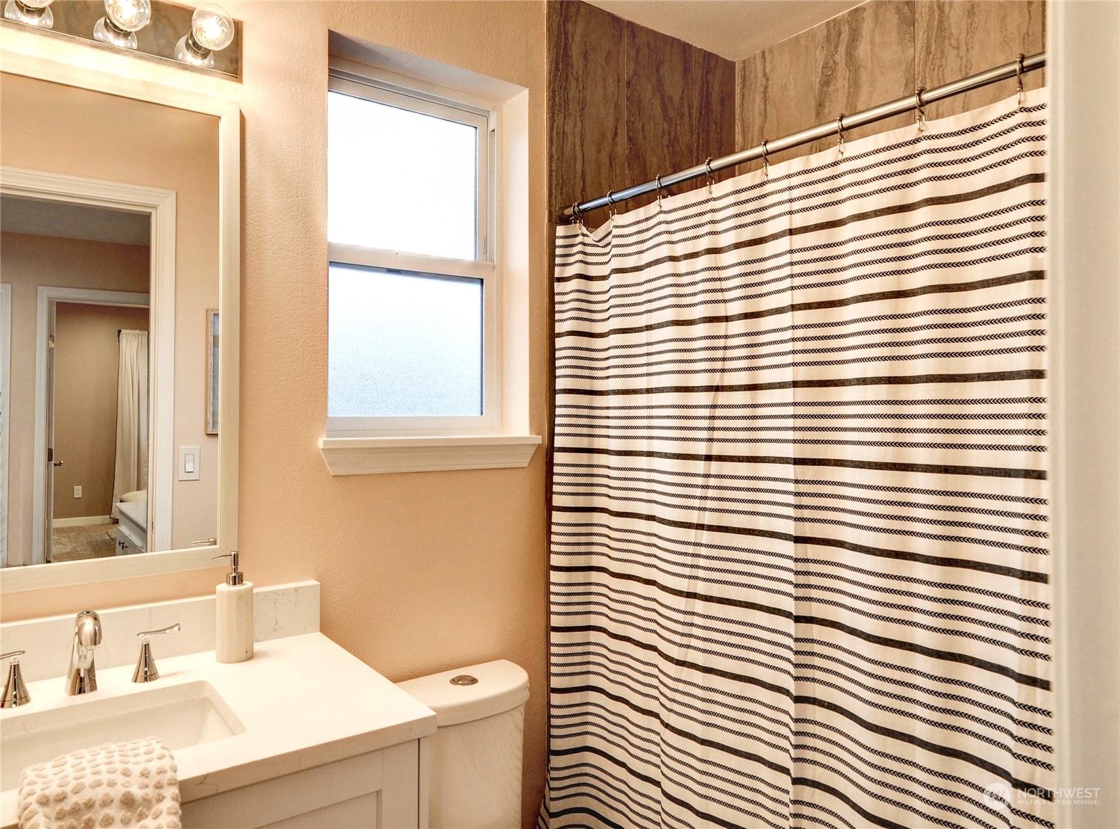 23111 15th Avenue Southeast, Unit E3 Bothell, WA 98021 - Photo 20 of 30 a bathroom with a sink a mirror and a window