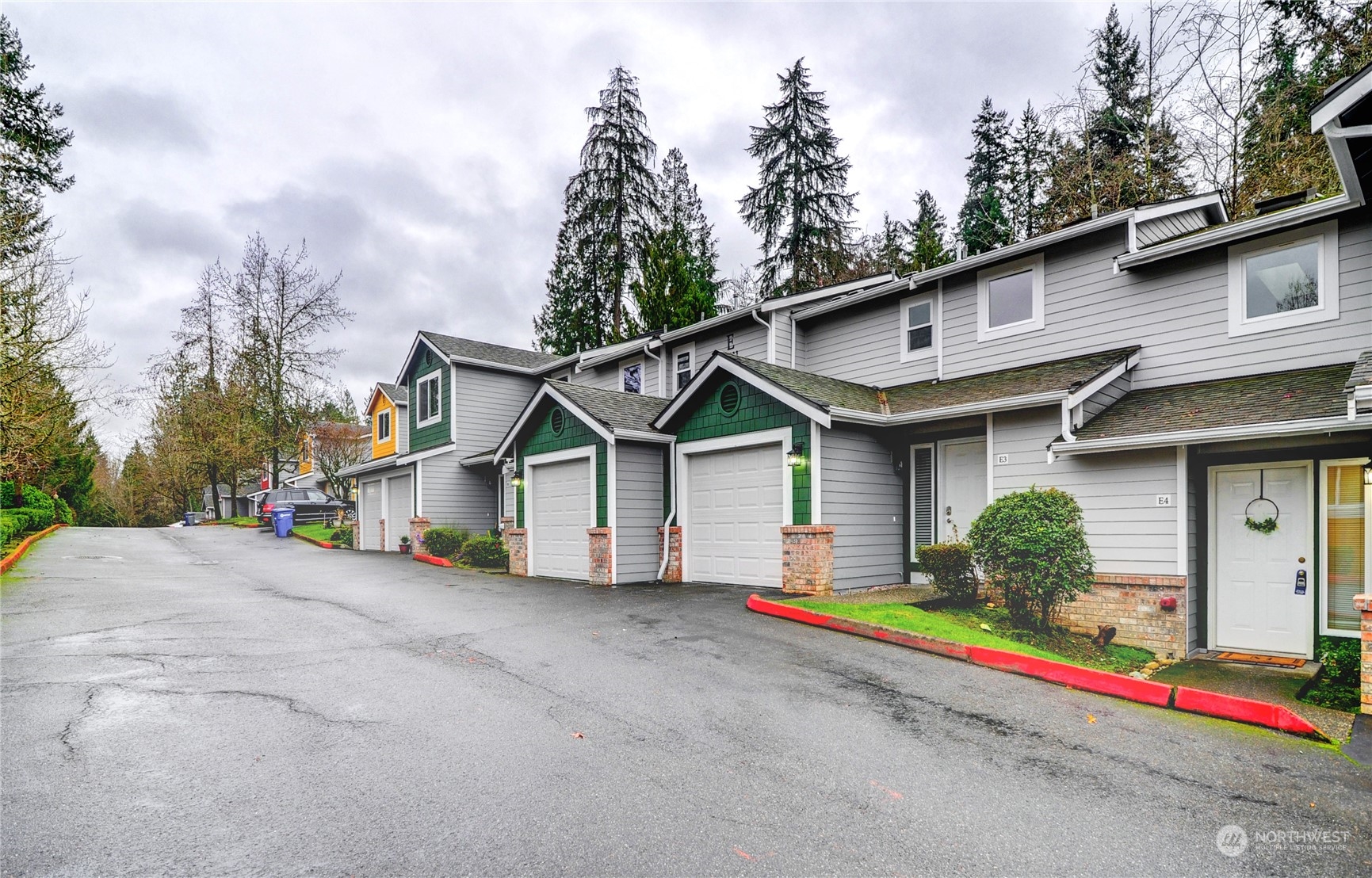 23111 15th Avenue Southeast, Unit E3 Bothell, WA 98021 - Photo 2 of 30 a house that has a tree in front of it