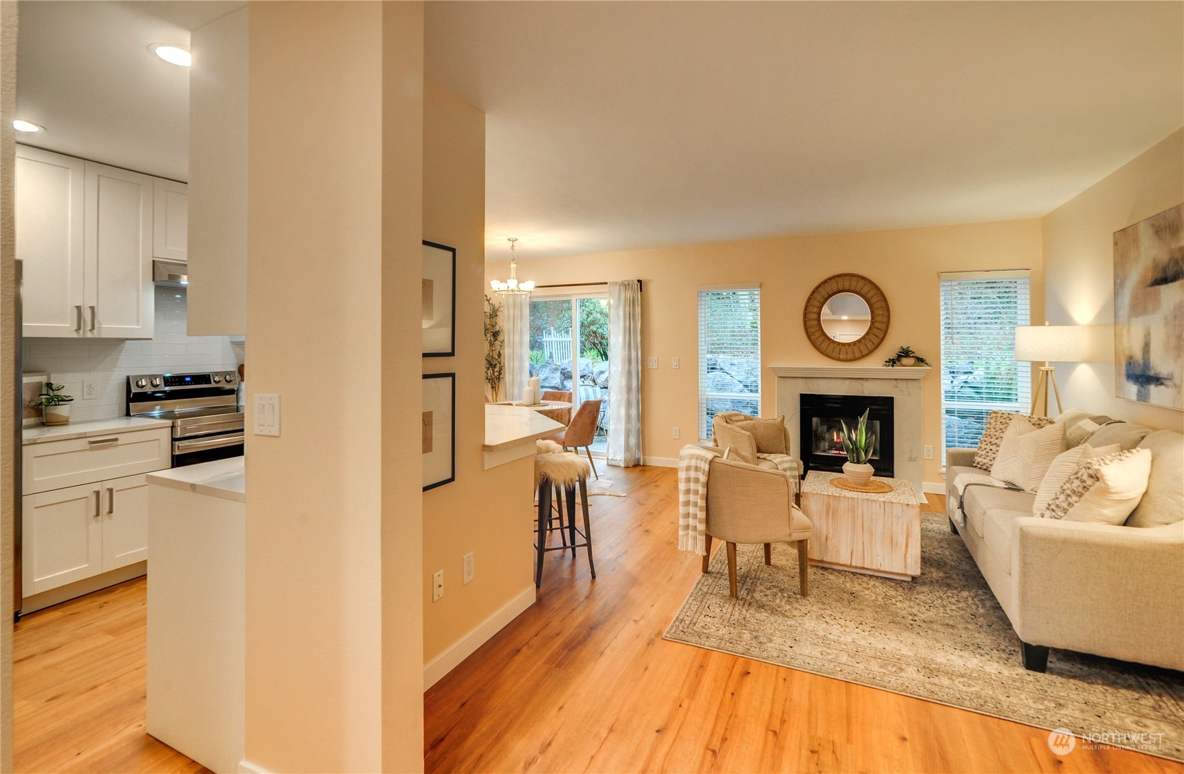 23111 15th Avenue Southeast, Unit E3 Bothell, WA 98021 - Photo 5 of 30 a living room with furniture and a fireplace