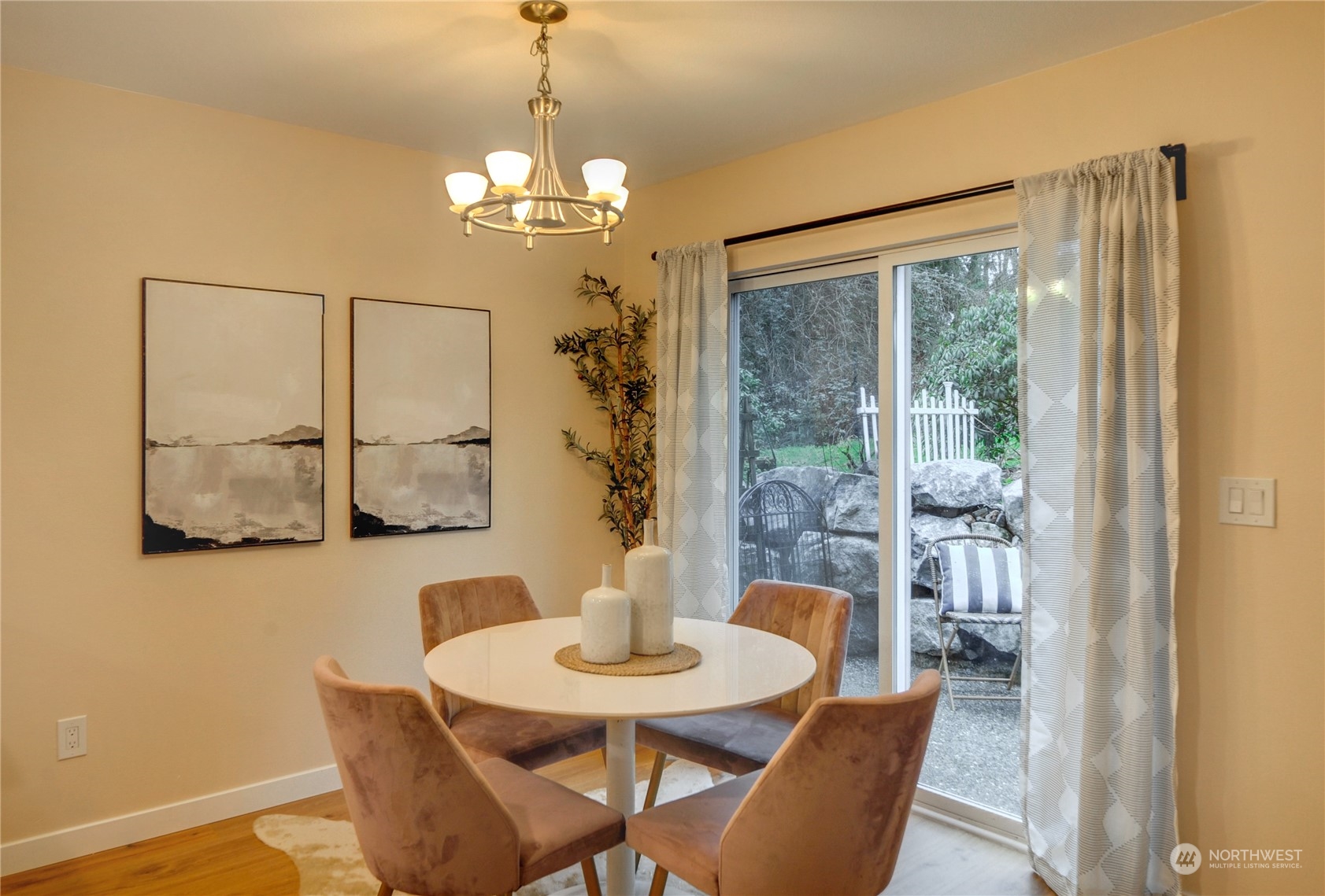 23111 15th Avenue Southeast, Unit E3 Bothell, WA 98021 - Photo 10 of 30 a view of a dining room with furniture wooden floor and a chandelier