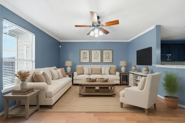a living room with furniture and a flat screen tv