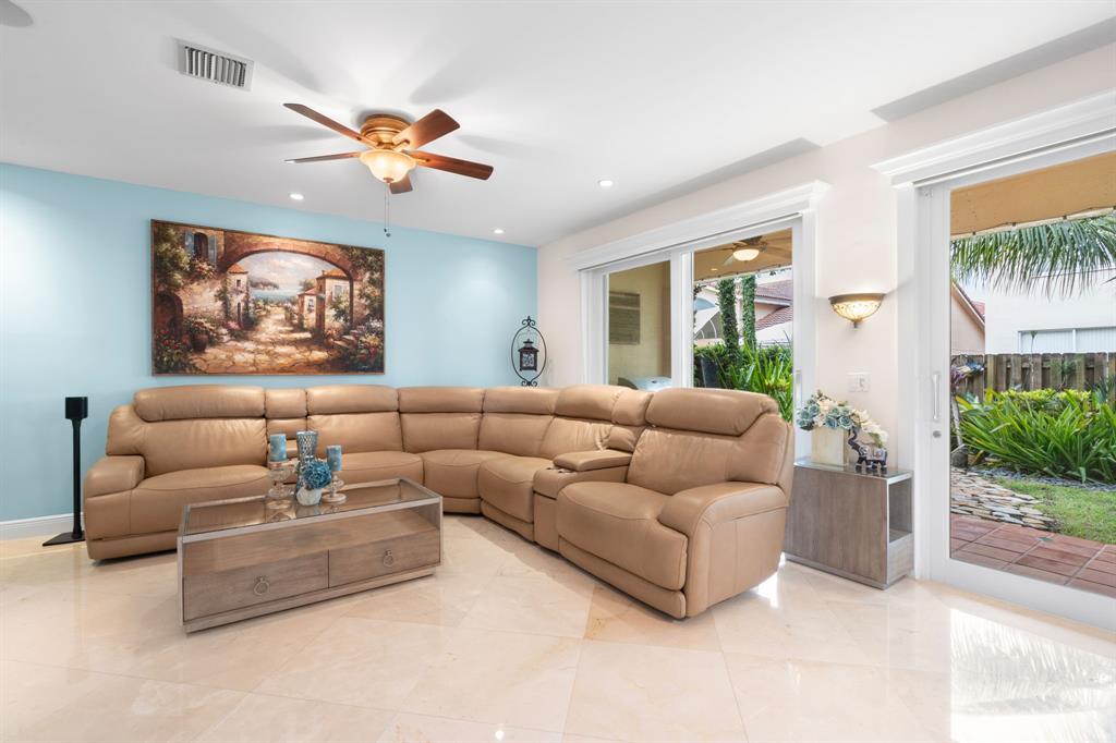 15256 Southwest 108th Terrace Miami, FL 33196 - Photo 16 of 40 a living room with furniture and a large window