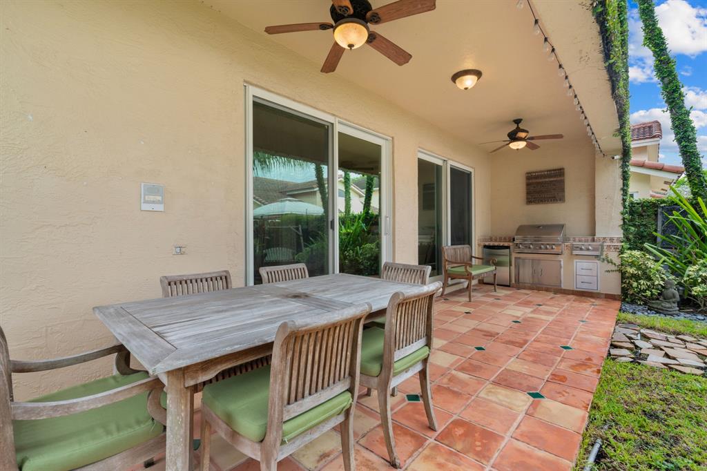 15256 Southwest 108th Terrace Miami, FL 33196 - Photo 35 of 40 a view of a patio with a table and chairs