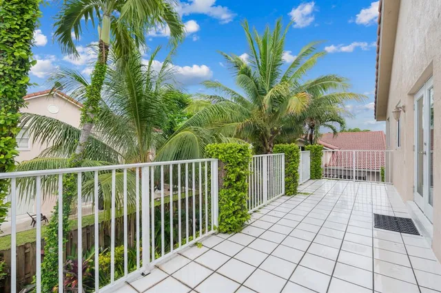 a view of a balcony with plants