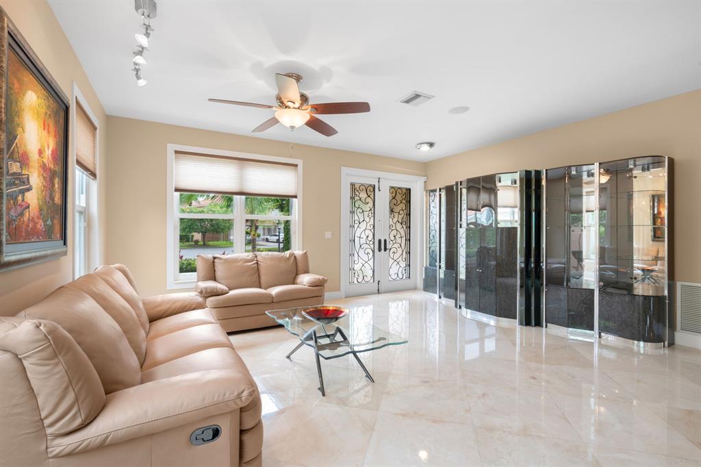 15256 Southwest 108th Terrace Miami, FL 33196 - Photo 6 of 40 a living room with furniture and a large window