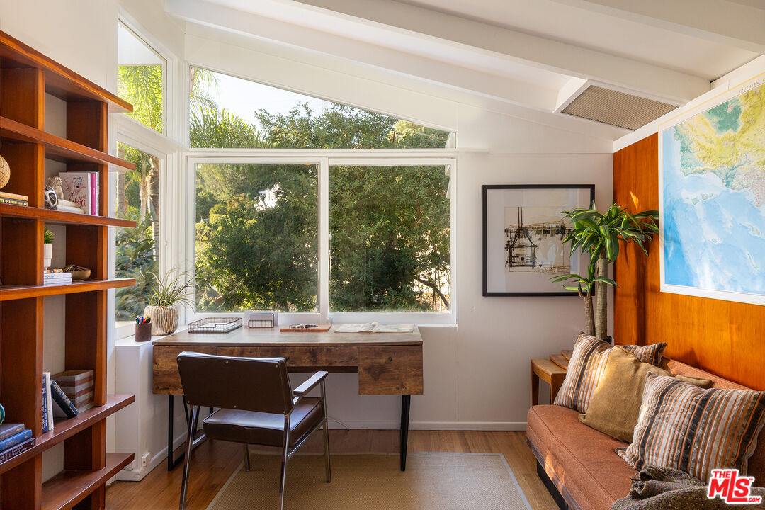 2764 Outpost Drive Los Angeles, CA 90068 - Photo 11 of 37 a living room with furniture and a floor to ceiling window