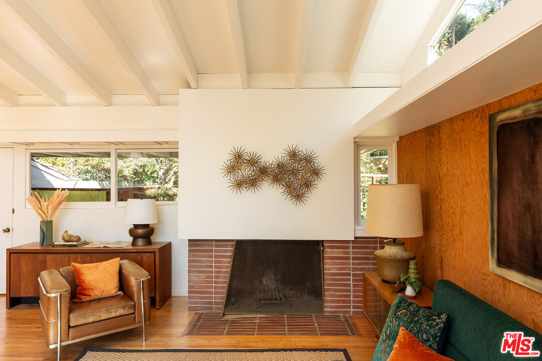 2764 Outpost Drive Los Angeles, CA 90068 - Photo 2 of 37 a living room with a couch and a table