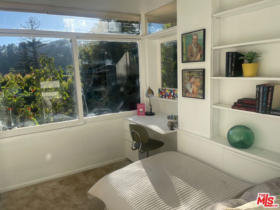 2764 Outpost Drive Los Angeles, CA 90068 - Photo 21 of 37 a bedroom with a bed and a window
