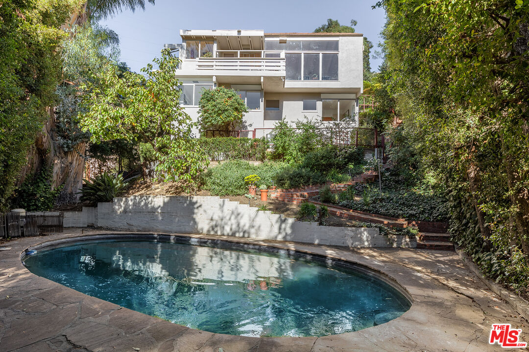 2764 Outpost Drive Los Angeles, CA 90068 - Photo 27 of 37 a view of a house with a swimming pool