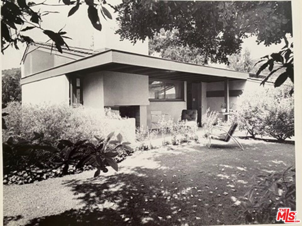 2764 Outpost Drive Los Angeles, CA 90068 - Photo 30 of 37 a view of a house with a yard covered with snow