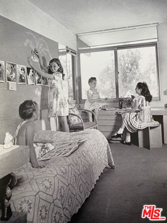 2764 Outpost Drive Los Angeles, CA 90068 - Photo 34 of 37 a bed room with two bed and a large window