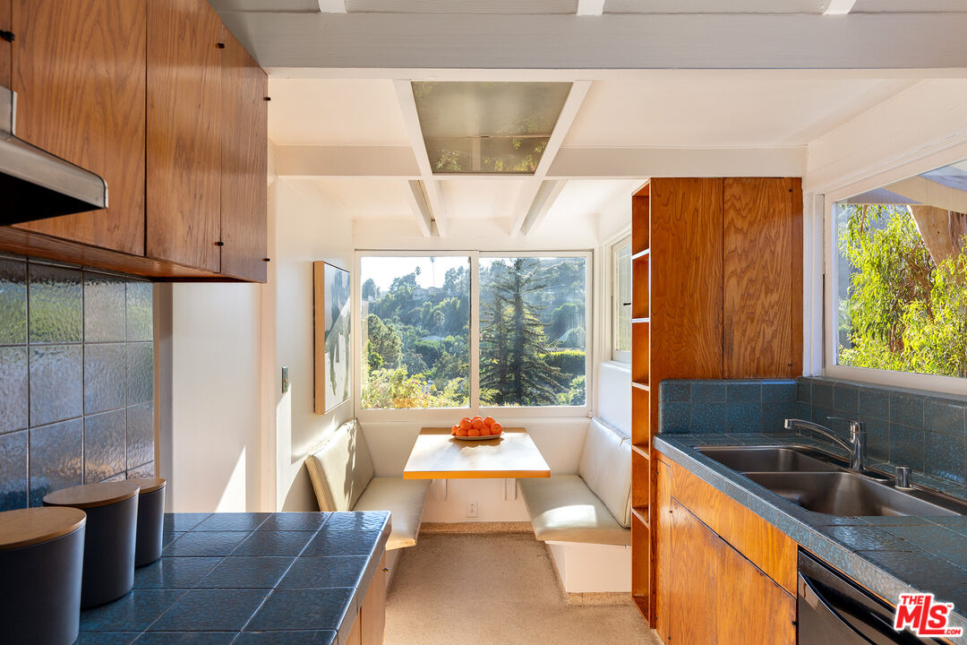 2764 Outpost Drive Los Angeles, CA 90068 - Photo 8 of 37 a large white kitchen with a large window