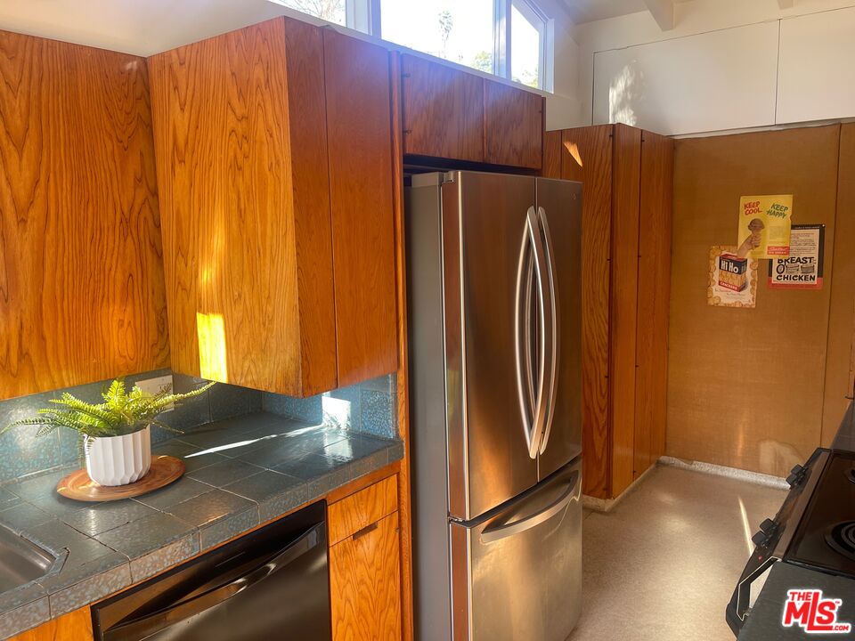 2764 Outpost Drive Los Angeles, CA 90068 - Photo 9 of 37 a kitchen with stainless steel appliances granite countertop a refrigerator and a stove