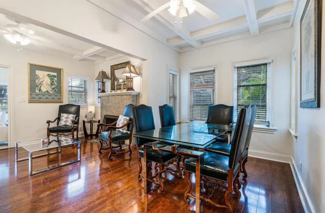 a view of a patio with table and chairs and potted plants