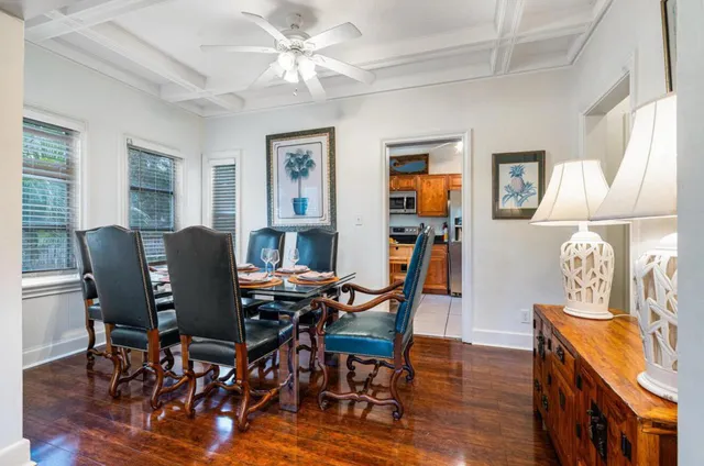 a view of a patio with a table and chairs and potted plants
