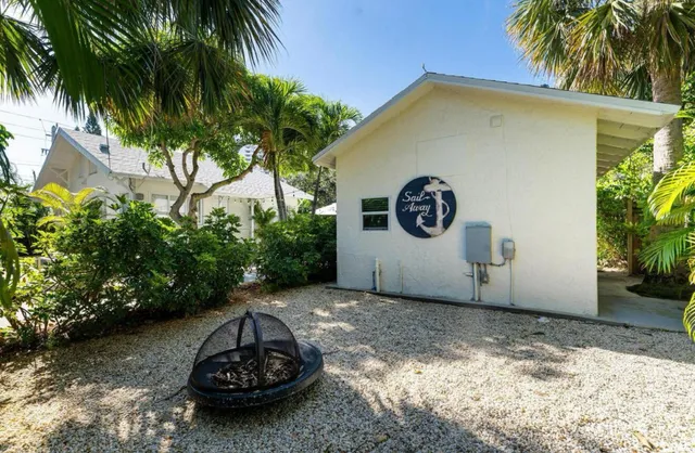 a dining room with furniture a window and wooden floor