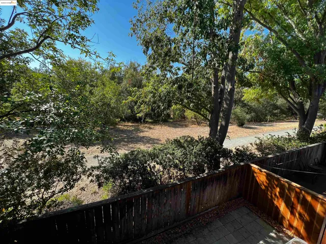 a view of balcony with wooden floor