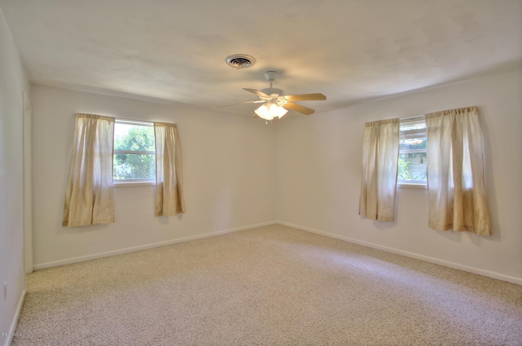 972 Sarno Road Melbourne, FL 32935 - Photo 13 of 20 Master Bedroom w/ Ceiling Fans