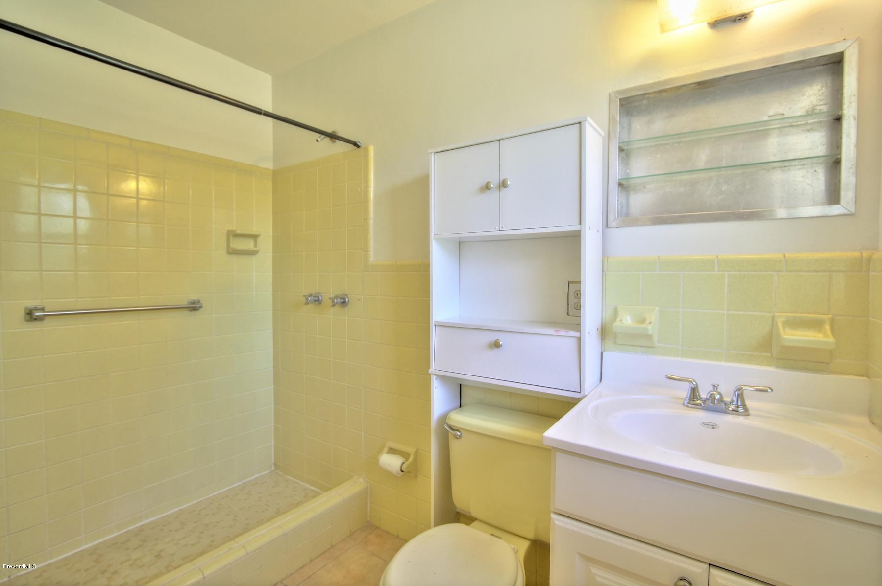 972 Sarno Road Melbourne, FL 32935 - Photo 14 of 20 Master Bath Neutral Tile
