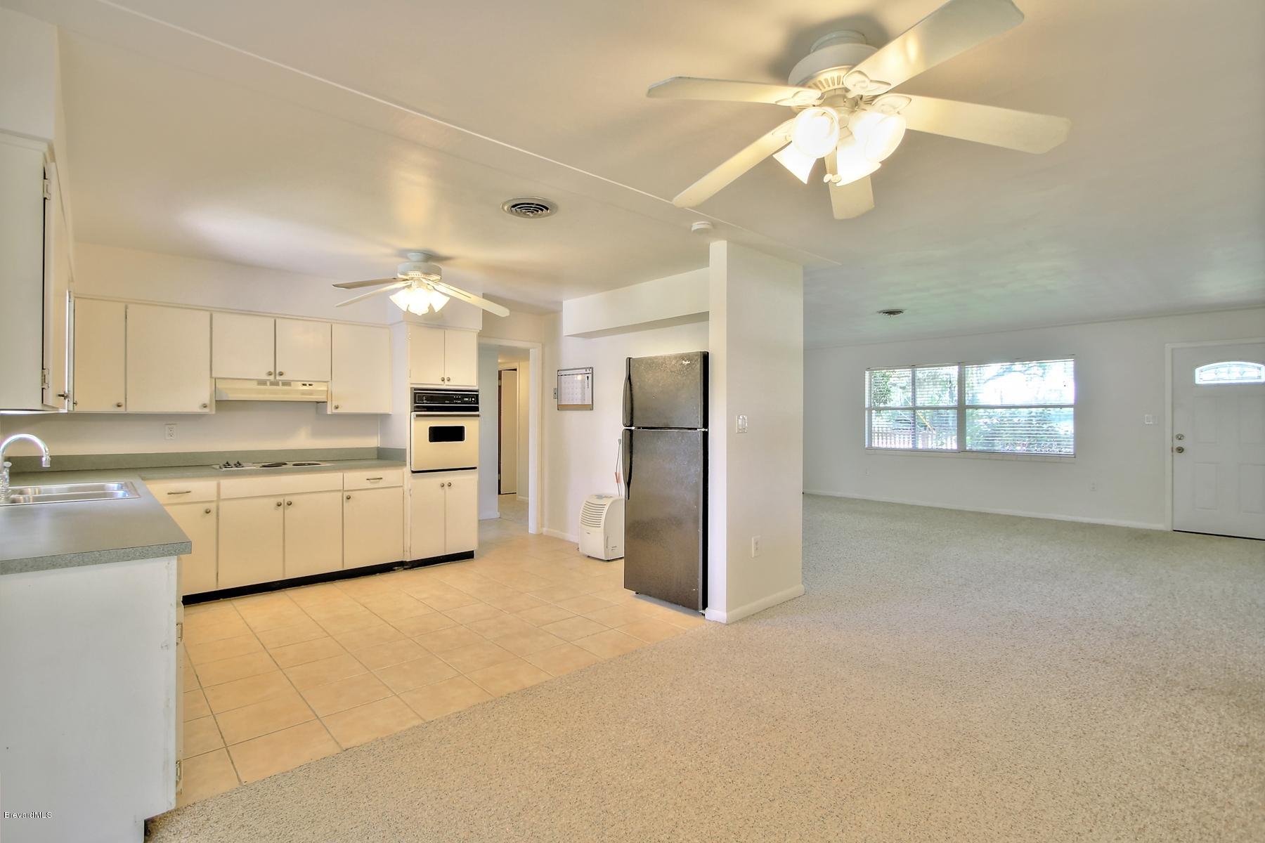 972 Sarno Road Melbourne, FL 32935 - Photo 10 of 20 View from Kitchen to Living Area