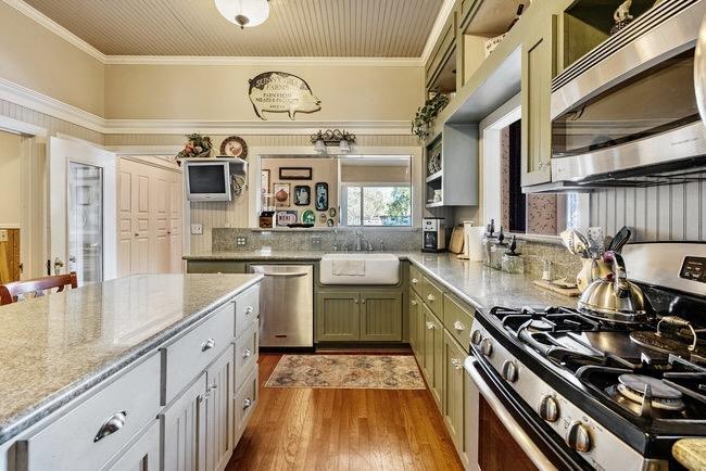610 San Felipe Road Gilroy, CA 95020 - Photo 22 of 52 a kitchen with kitchen island granite countertop a stove and a sink