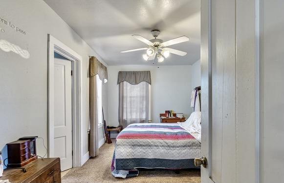 610 San Felipe Road Gilroy, CA 95020 - Photo 44 of 52 a bedroom with a bed and a chandelier