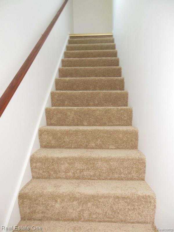 10155 Roberts Road Gregory, MI 48137 - Photo 44 of 89 Stairs to bonus room Office/Man cave.