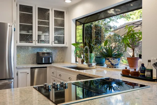 a kitchen with a stove and a sink