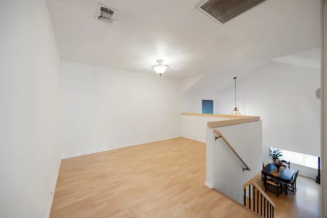a view of a livingroom with furniture and wooden floor