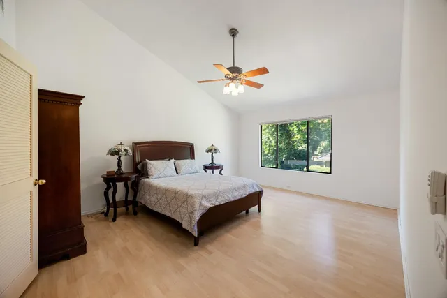 a living room with a bed furniture and a window