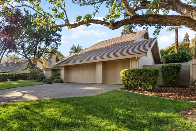 a view of a house with a garden