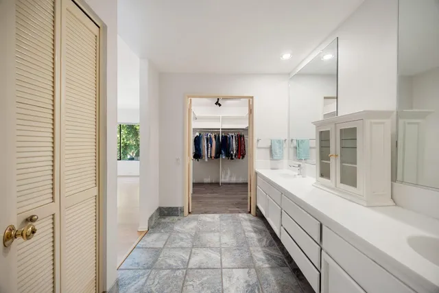a bathroom with a bathtub and a sink