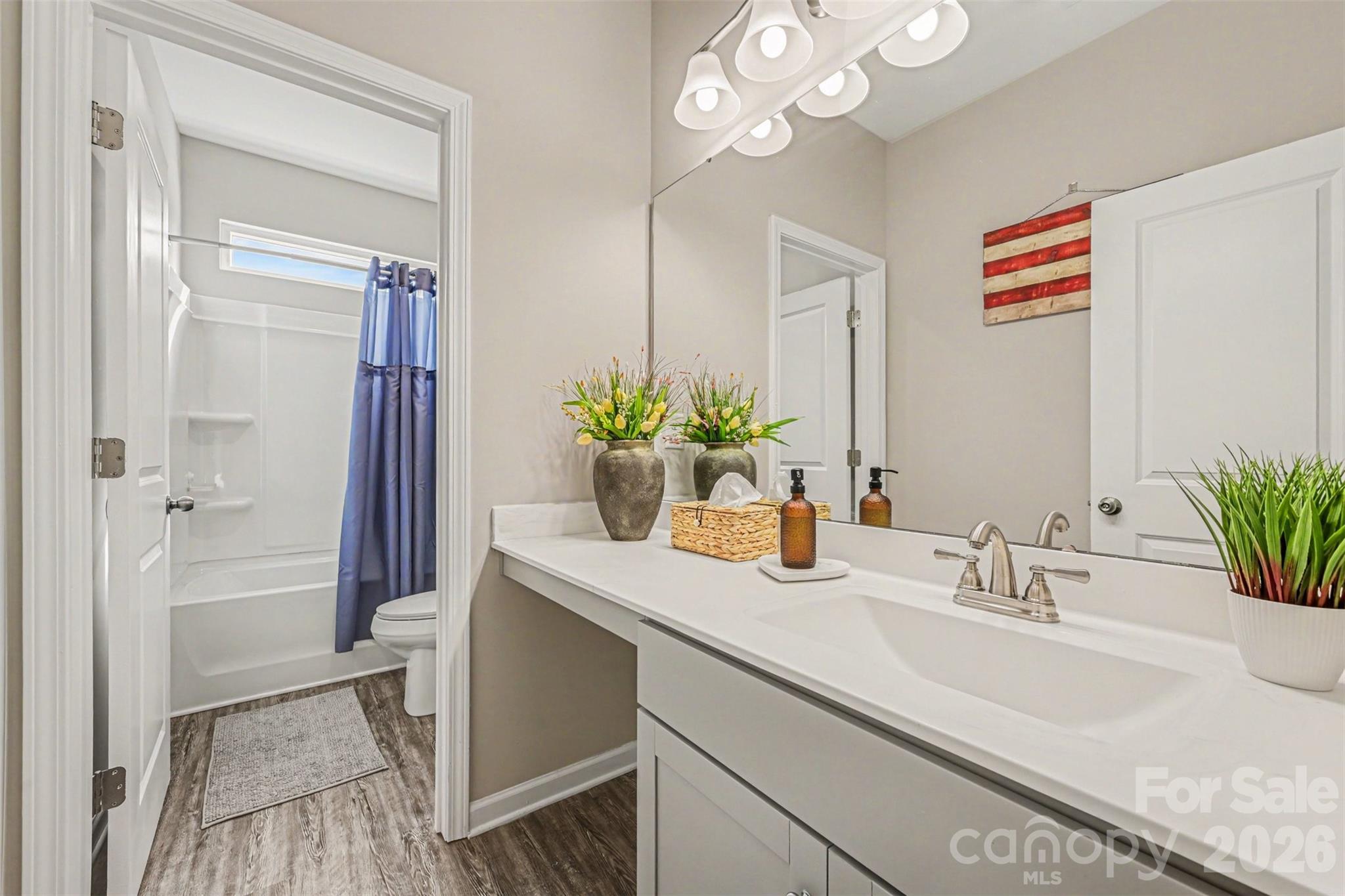 425 Kiser Lane Locust, NC 28097 - Photo 22 of 25 a bathroom with a sink a vanity and a mirror